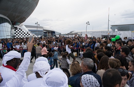 A crowd gathers to watch a live dance show from Brazil. DF Photo