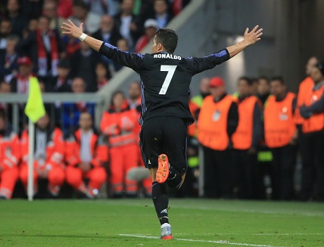 Real Madrid's Cristiano Ronaldo celebrates scoring during the UEFA Champions League quarter-final first leg match between Bayern Munich and Real Madrid in Munich, Germany, on April 12, 2017. Photo Xinhua.