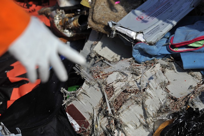 An officer of the Search and Rescue shows the debris of the Lion Air plane found on the sea, at the Tanjung Priok port, Jakarta, Indonesia, Oct. 29, 2018. Photo Xinhua by Veri Sanovri.